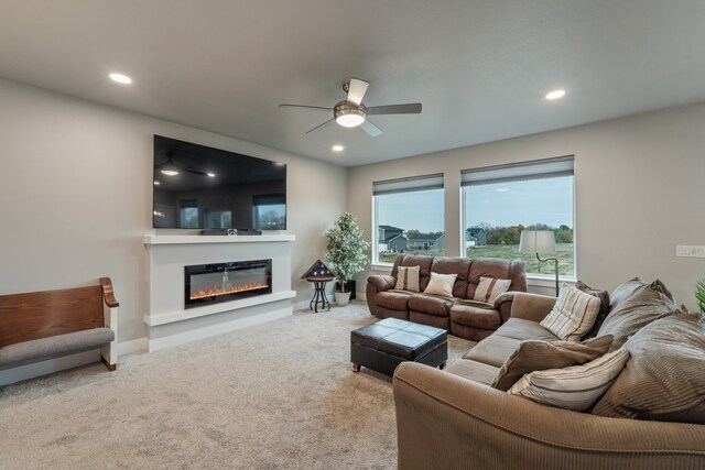 living room featuring light colored carpet and ceiling fan