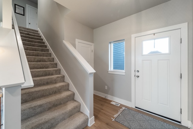 foyer entrance featuring wood-type flooring