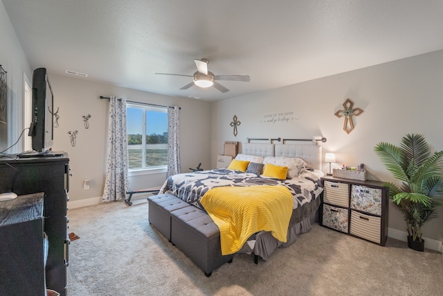 carpeted bedroom with ceiling fan