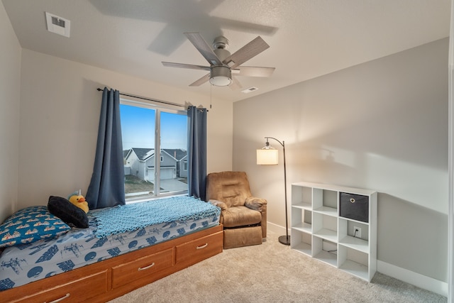 bedroom featuring carpet, access to exterior, and ceiling fan