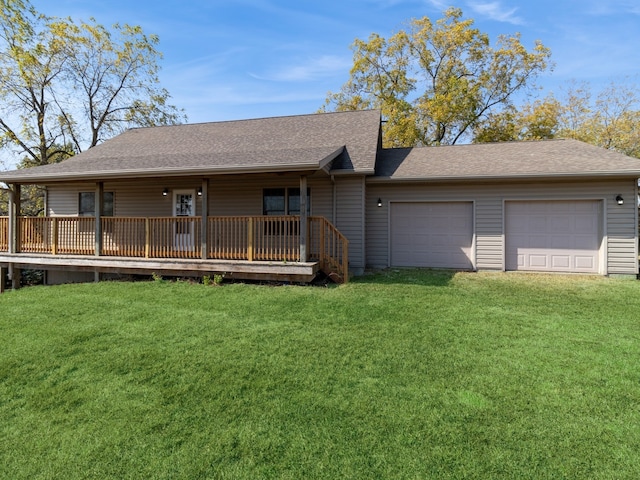 ranch-style home with a deck, a front lawn, and a garage