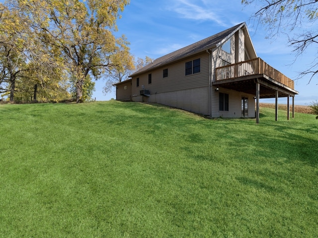 exterior space featuring a wooden deck and a yard