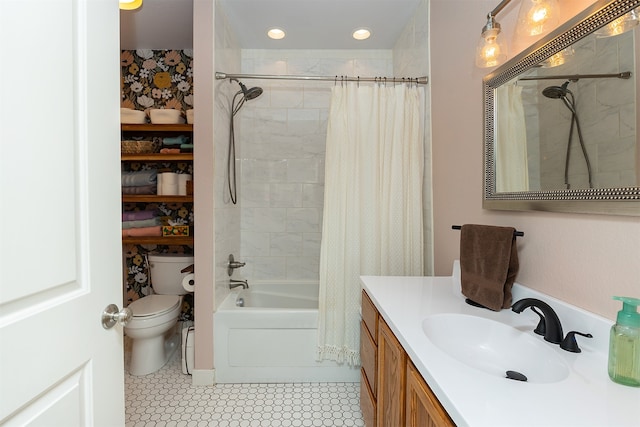 full bathroom featuring vanity, toilet, tile patterned floors, and shower / tub combo