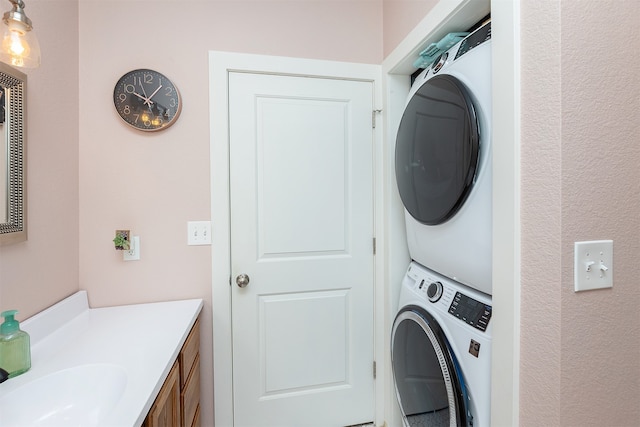 laundry room with stacked washing maching and dryer