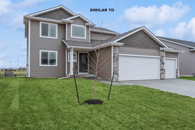 view of front of home featuring a garage and a front lawn