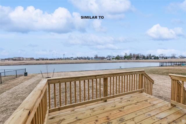 wooden deck with a water view