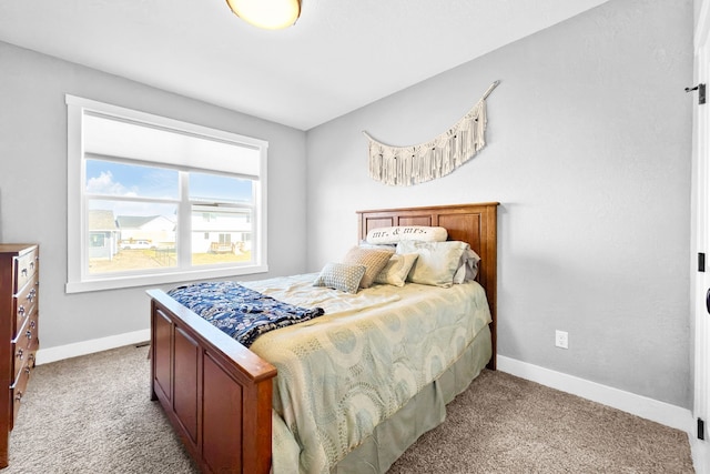 bedroom featuring light colored carpet