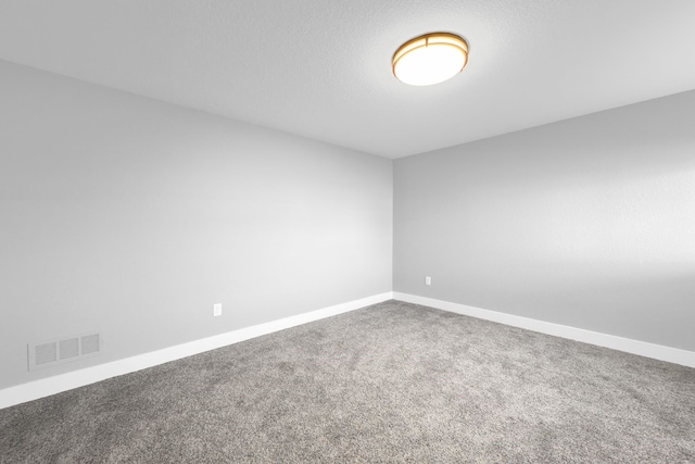 unfurnished room featuring carpet flooring