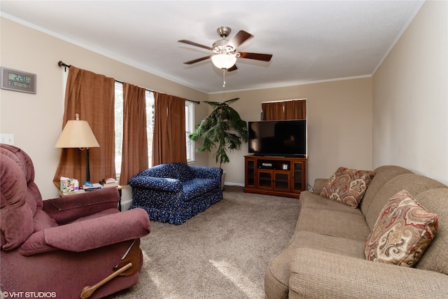 carpeted living room featuring ceiling fan and crown molding