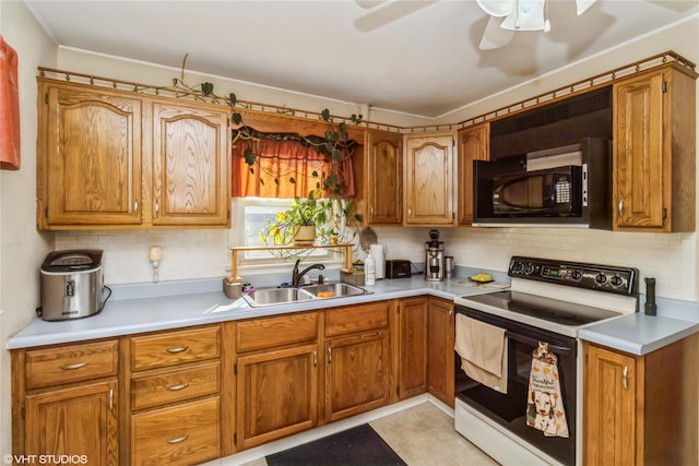 kitchen featuring light tile patterned flooring, tasteful backsplash, white electric range oven, and sink