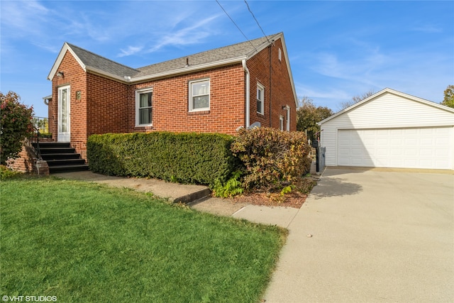 view of home's exterior with an outbuilding, a garage, and a lawn