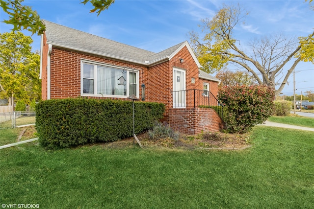 view of property exterior with a lawn