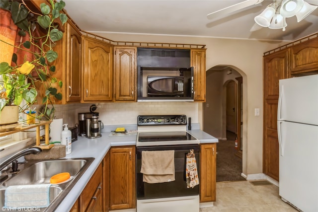 kitchen with white appliances, tasteful backsplash, sink, ceiling fan, and light tile patterned floors