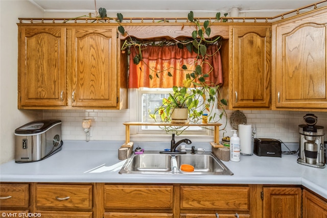 kitchen with decorative backsplash and sink