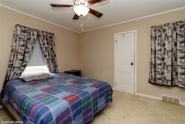 bedroom featuring crown molding, carpet, and ceiling fan