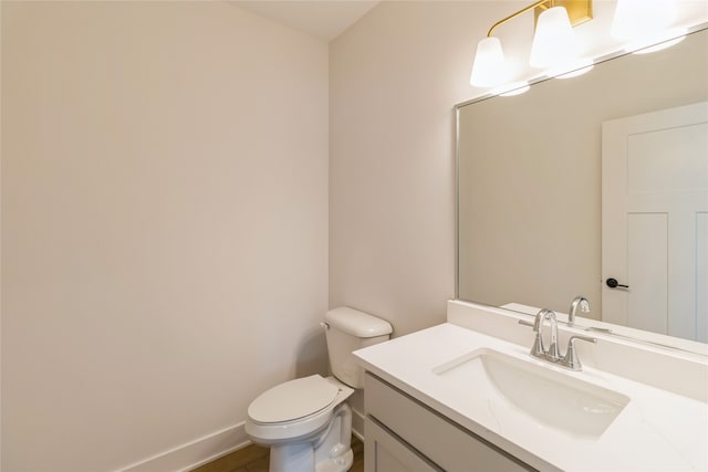 bathroom with toilet and vanity