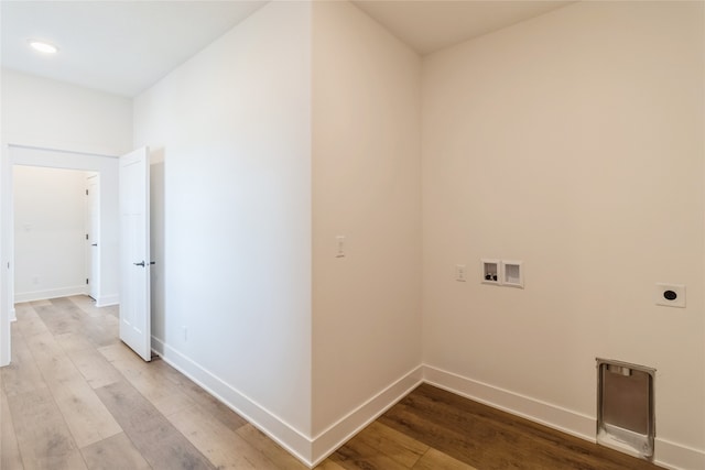 washroom with light hardwood / wood-style flooring, washer hookup, and electric dryer hookup