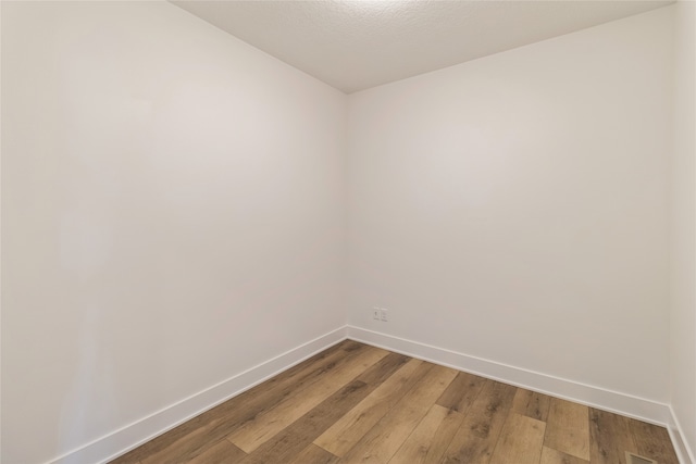 spare room featuring hardwood / wood-style flooring