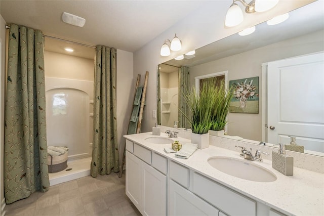 bathroom with vanity and a shower with shower curtain