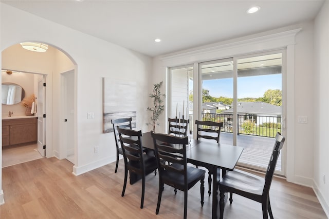 dining space featuring light hardwood / wood-style floors and sink