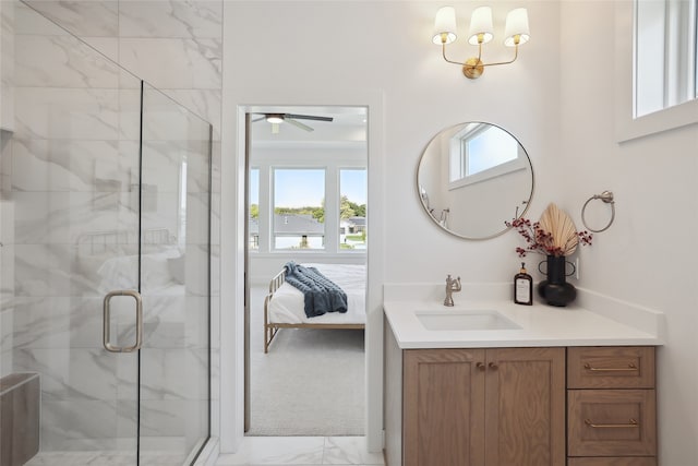 bathroom featuring vanity and a shower with shower door