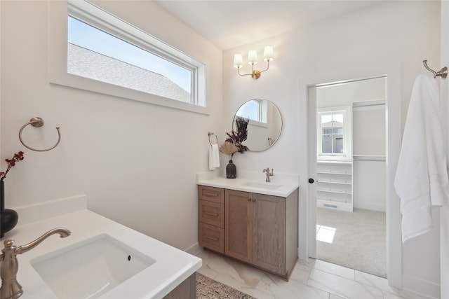 bathroom with vanity and a wealth of natural light