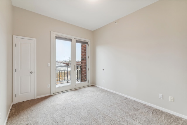 carpeted empty room featuring a healthy amount of sunlight