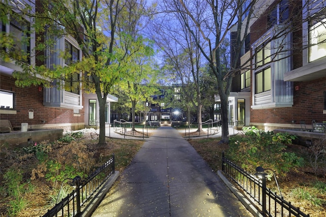 view of home's community with fence