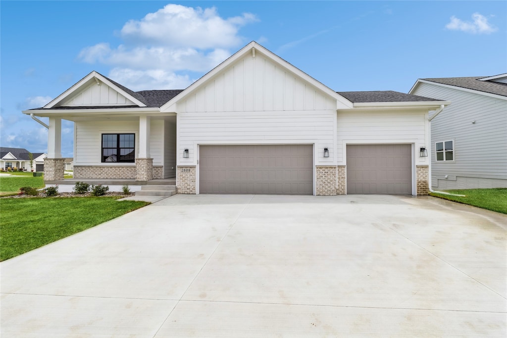 view of front facade with a garage and a front lawn