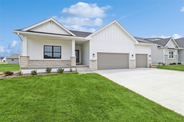 view of front of property featuring a garage and a front lawn