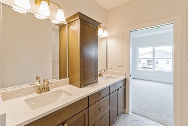 bathroom featuring vanity and parquet flooring