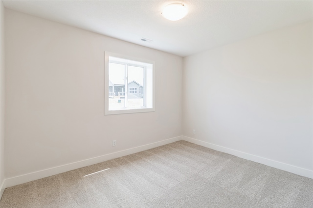 unfurnished room with carpet floors