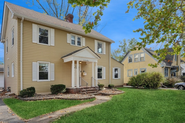 view of front of house with a front lawn