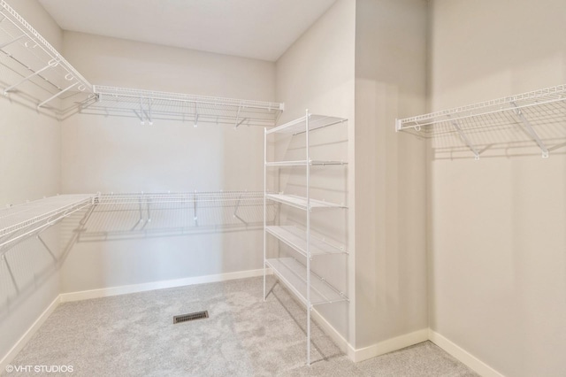 walk in closet with carpet and visible vents