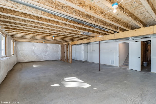 basement with stairway and visible vents