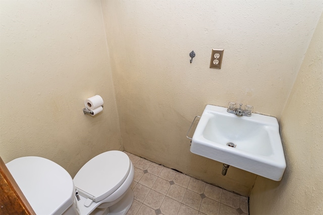 bathroom with sink and toilet