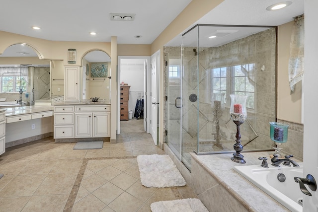 bathroom featuring vanity, separate shower and tub, and tile patterned flooring