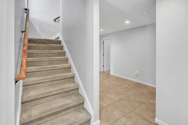 stairs with tile patterned floors