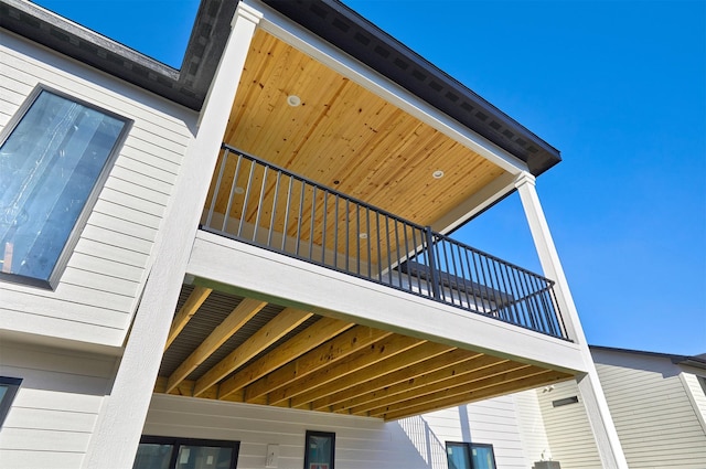 view of side of home featuring a balcony