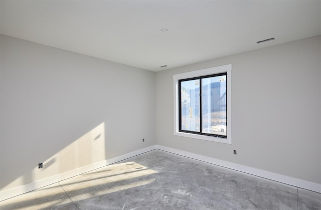 spare room featuring concrete floors