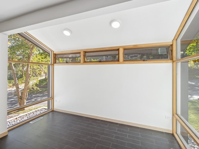 unfurnished sunroom featuring visible vents