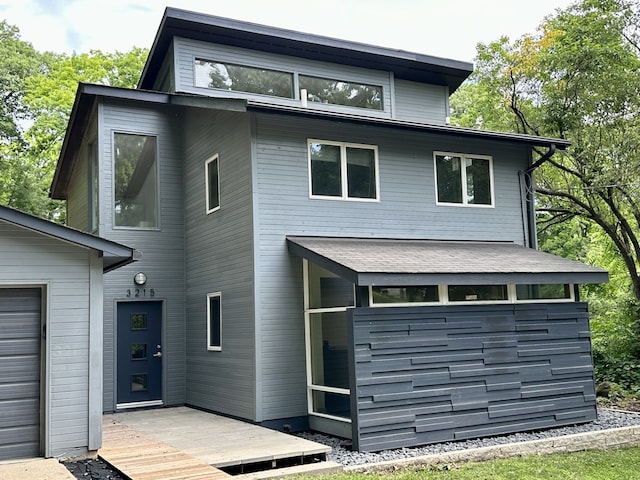 rear view of property with a wooden deck