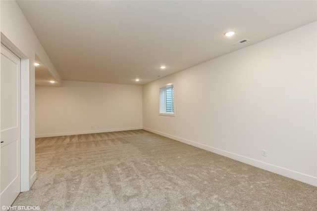 spare room with light carpet