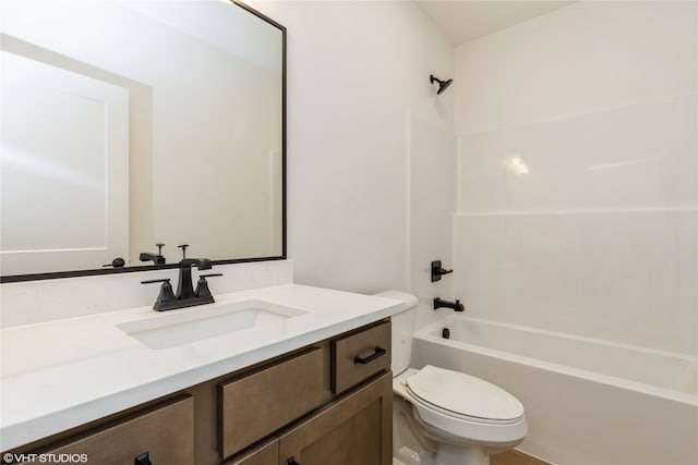 full bathroom featuring bathing tub / shower combination, toilet, and vanity