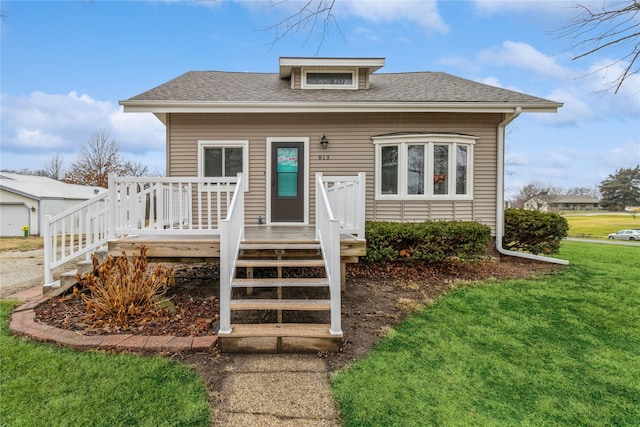 bungalow-style home featuring a front yard