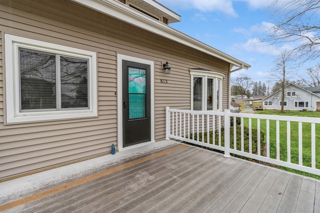 wooden terrace with a yard