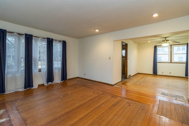 unfurnished room featuring ceiling fan and wood-type flooring