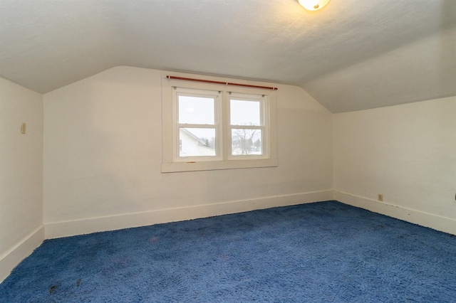 bonus room featuring carpet floors and lofted ceiling