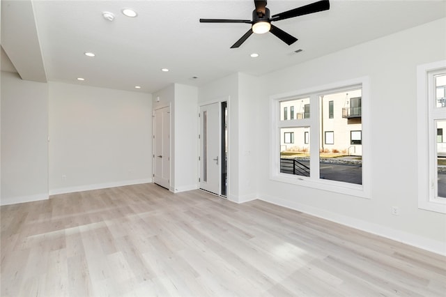 unfurnished room with light hardwood / wood-style flooring and ceiling fan