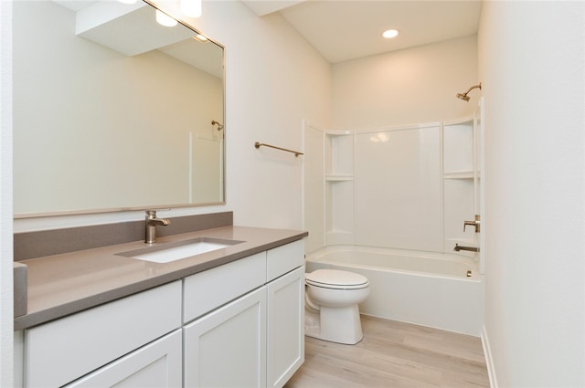 full bathroom with vanity, wood-type flooring, shower / bathing tub combination, and toilet